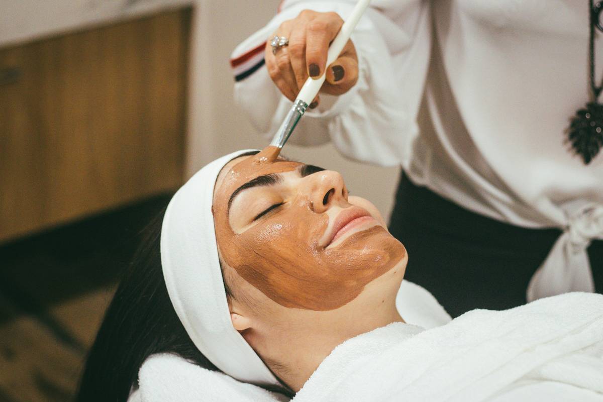 Woman applying retinol side effect cream good anti to calm irritated skin